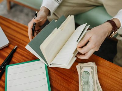 Notebook and a pen on a wooden table