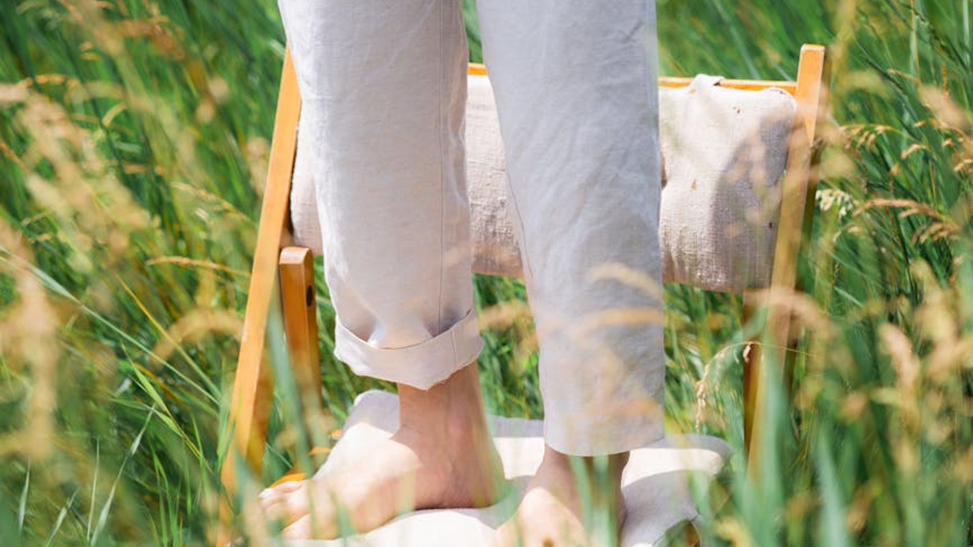 Person looking into the distance in a green field